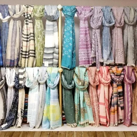 Sky Fashion showroom rack of scarves